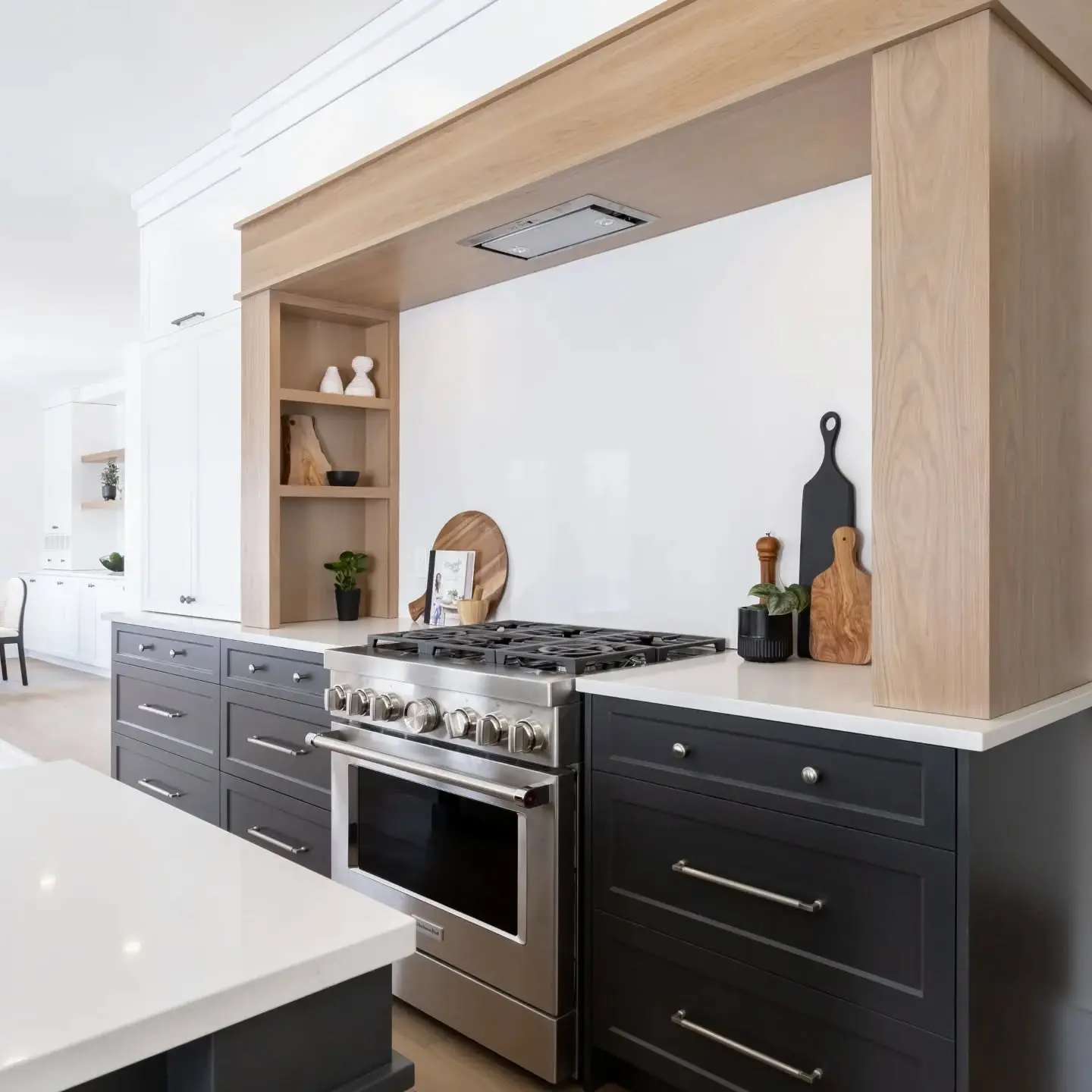 Slab white oak kitchen with island and backsplash cabinetry by Heirlooms Custom Cabinetry
