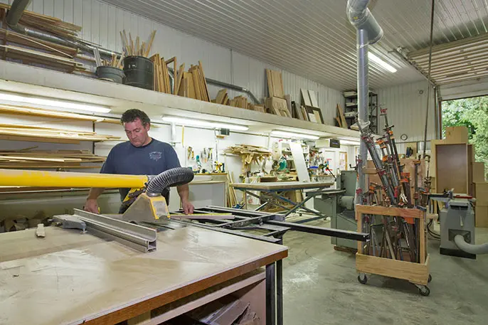 Dwayne crafting custom cabinetry in the Heirlooms workshop